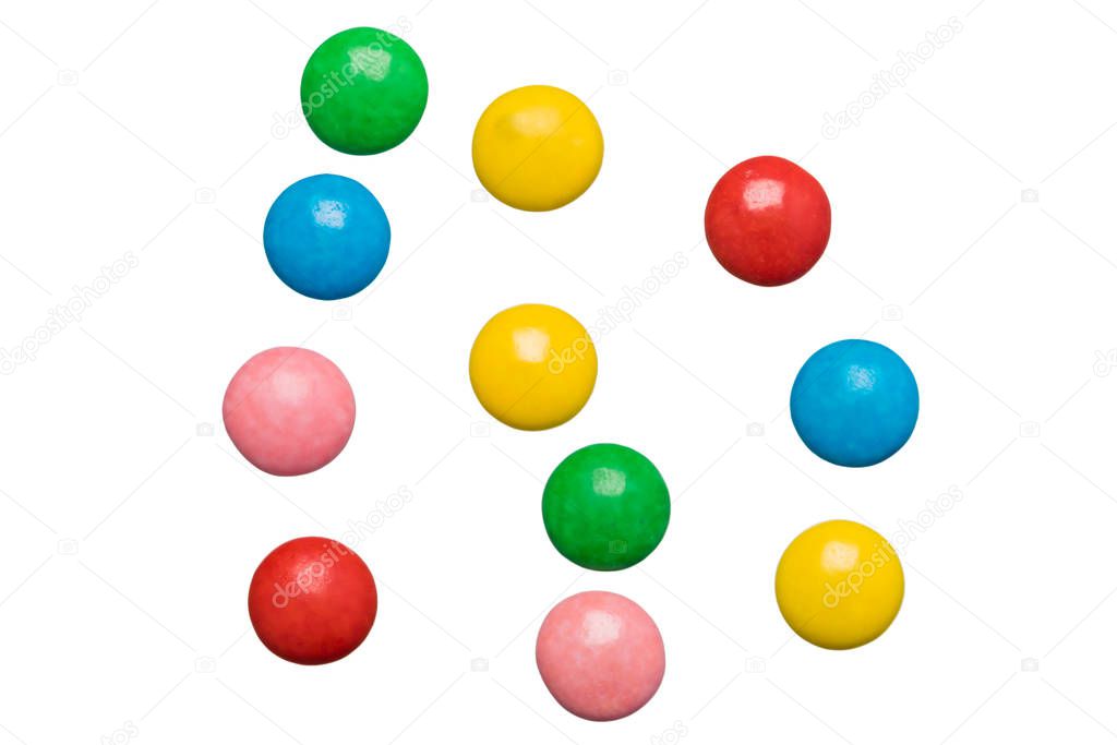 small round dragee of different colors isolated on a white background