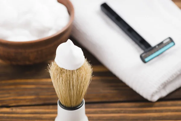 Shaving tools : brush, foam, shaver.