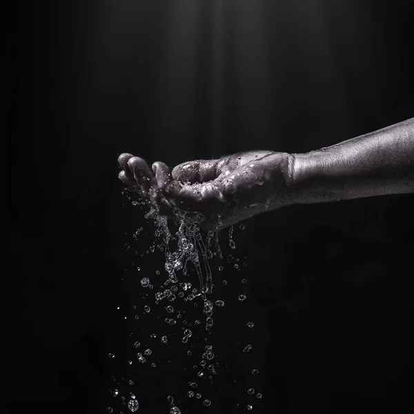 water stream on woman hand,water splashes on the palm