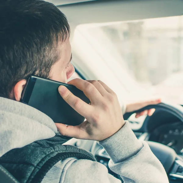 Calling by driving. Risky driver using phone while driving. square — Stock Photo, Image