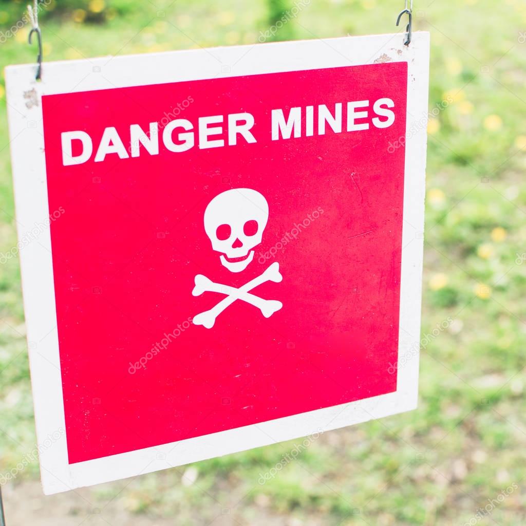 Warning sign - Danger mines on a forest