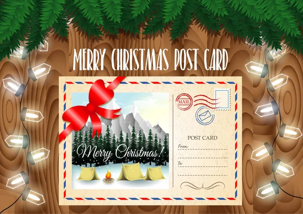 Frohe Weihnachten Postkartenmotiv auf dem Holztisch mit Christbaumzweigen und Girlanden Lichter. Zelten in Berglandschaft. — Stockvektor