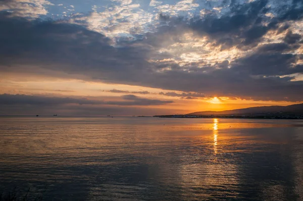 Захід сонця на морі Стокове Зображення