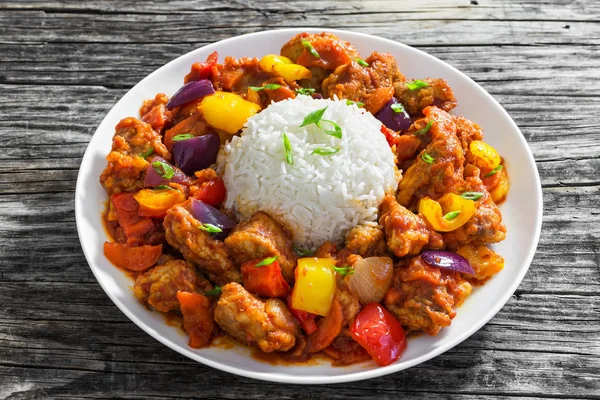 Rice with Sweet and Sour fried pork chunks Stock Photo