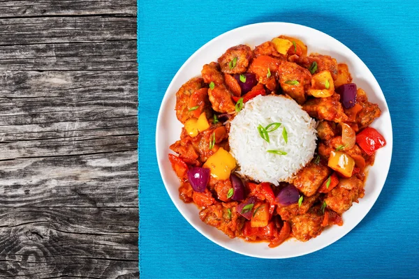 Rice with Sweet and Sour fried pork chunks Stock Picture