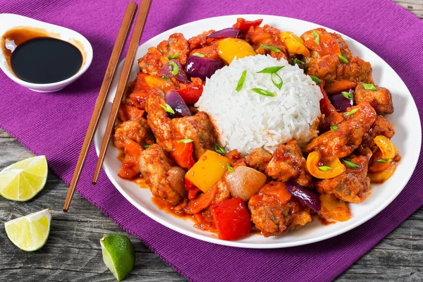 Rice and pork chunks with vegetables, view from above Stock Image
