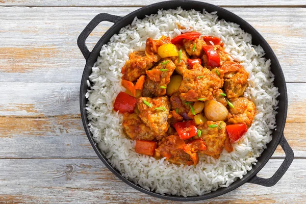 Rice and Sweet and Sour fried pork chunks Stock Photo