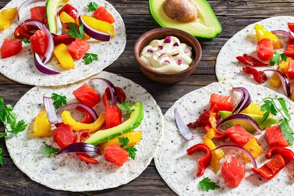 Delicious healthy fajitas with chunks of smoked salmon — Stock Photo, Image