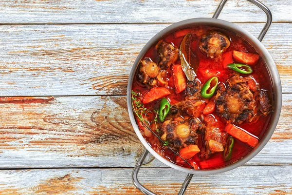 Beef tail stew with vegetables, thyme, red wine — Stock Image Beef tail stew with vegetables, thyme, red wine Royalty Free Stock Photos