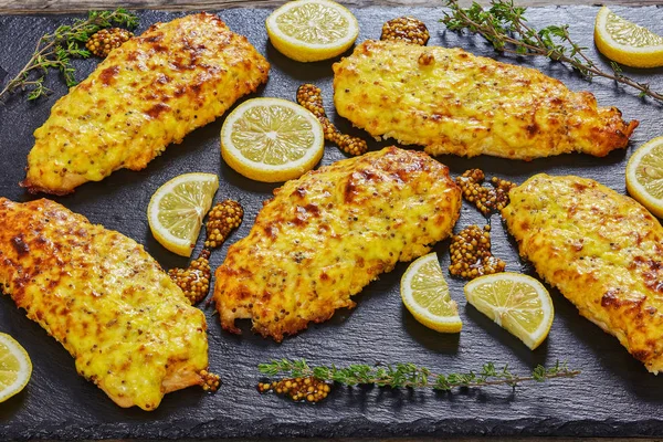 Delicious Baked Chicken breast on slate plate — Stock Photo, Image