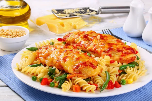 Fusilli pasta and baked Chicken breasts — Stock Photo, Image