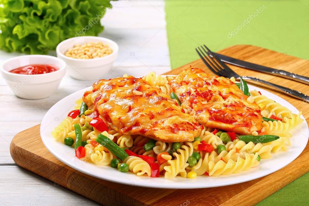 Grilled Chicken breasts and pasta on plate — Stock Photo © myviewpoint 149424218