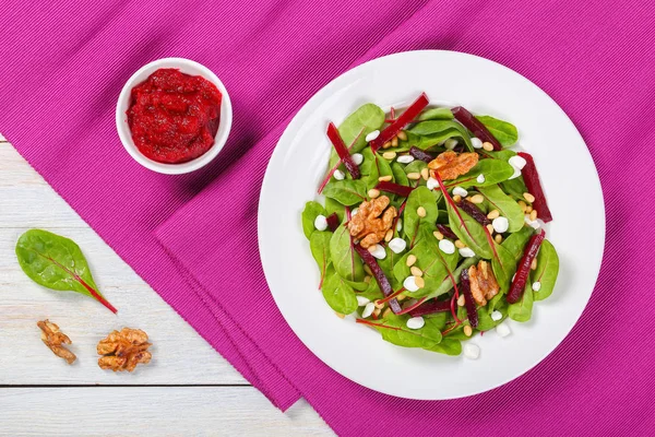 Caramelized walnuts salad on white plate — Stock Photo, Image