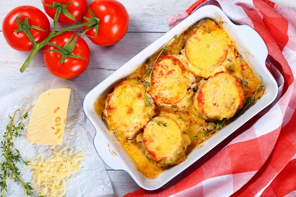 Meat chops layered with vegetables and cheese — Stock Photo, Image