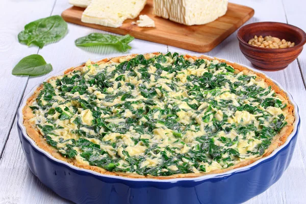 Spinach, Feta, ricotta spring tart in dish — Stock Photo, Image