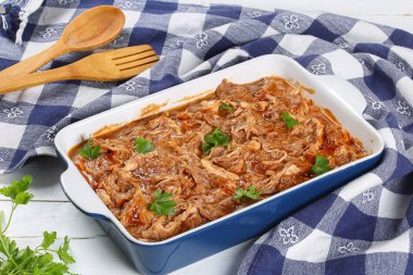 Shredded chicken meat tossed in sauce clipart