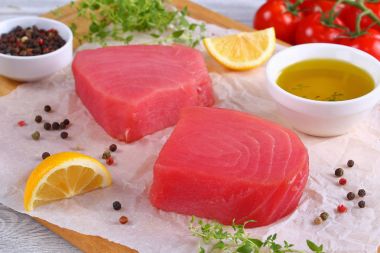 delicious Fresh raw tuna fish steaks clipart