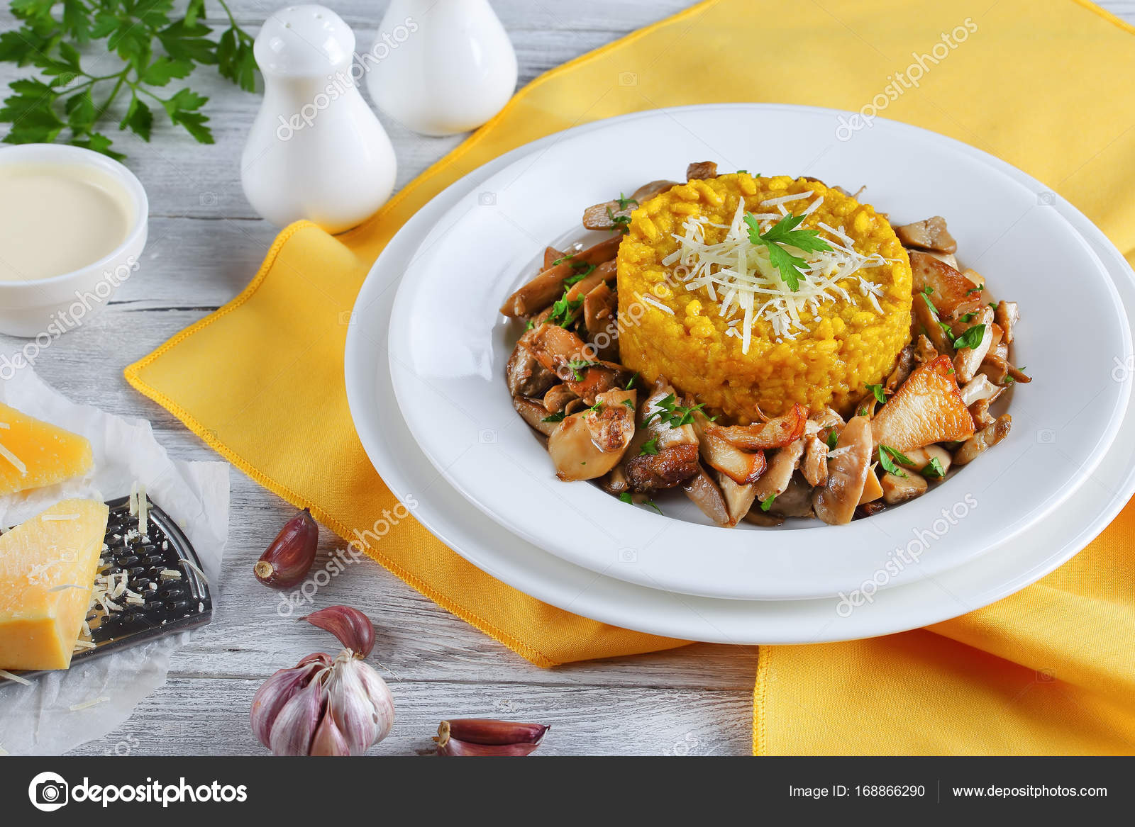 Saffron creamy risotto with fried porcini Stock Photo by ©myviewpoint