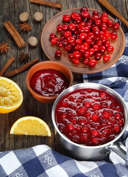 Cranberry sauce  in a saucepan and in a bowl — Stock Photo, Image