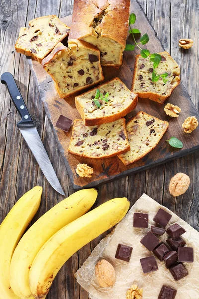 Banana bread sliced on cutting board — Stock Photo, Image