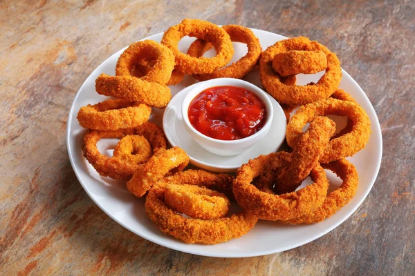 Close-up of delicious fried onion rings — Stock Photo, Image