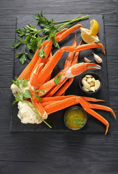Cooked Crab legs on slate plate — Stock Photo, Image