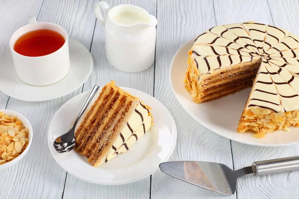 Whole esterhazy torte and a slice on spatula — Stock Photo, Image