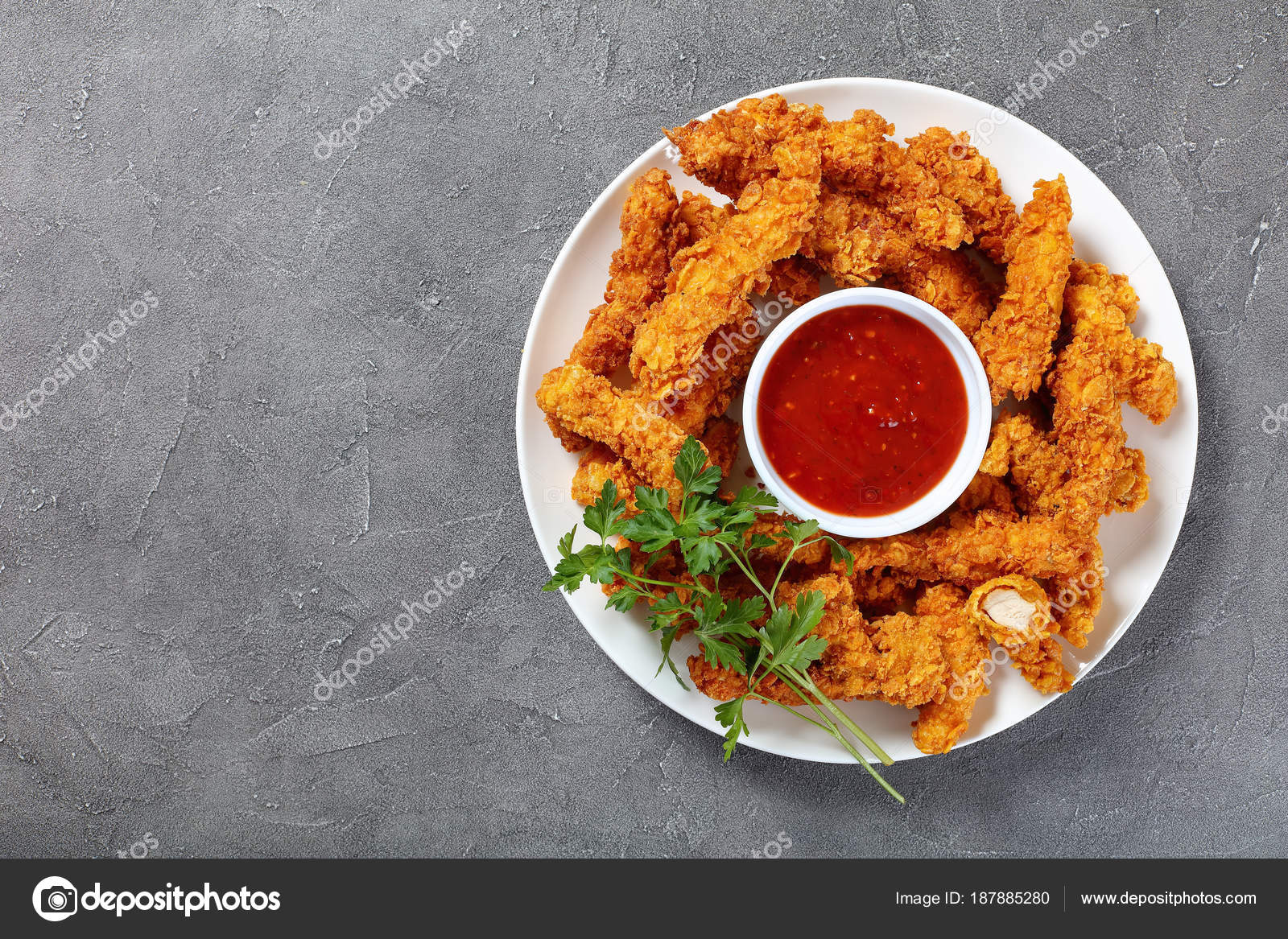 Crispy fried chicken breast strips on plate Stock Photo by ©myviewpoint