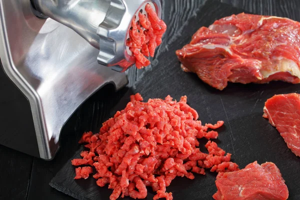 Electric meat grinder is making forcemeat — Stock Photo, Image