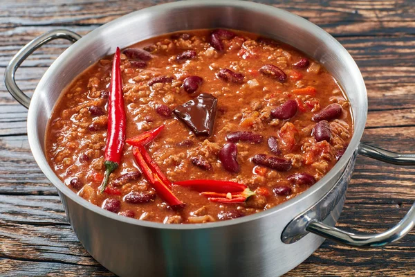 chili con carne with whole red chilis