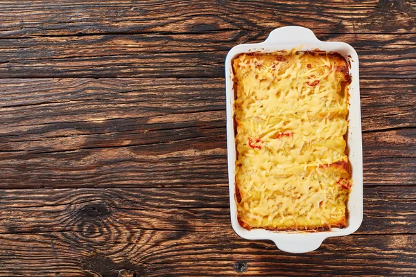 Hot tasty enchiladas in baking dish — Stock Photo, Image