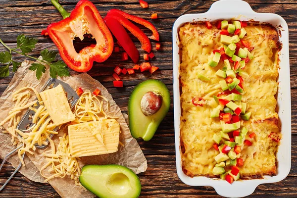 Enchiladas sprinkled with pieces of avocado — Stock Image Enchiladas sprinkled with pieces of avocado Royalty Free Stock Images