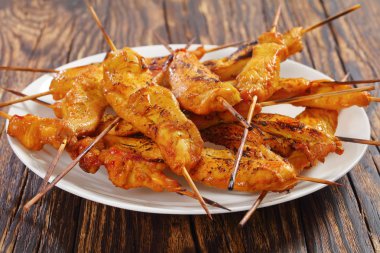 grilled Chicken satay on skewers, close-up clipart