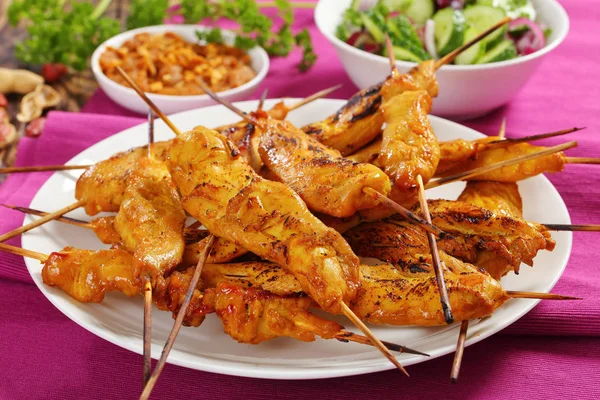 Close-up of Chicken satay on skewers — Stock Photo, Image