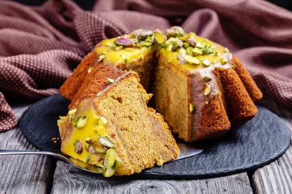 Pumpkin carrot pound cake with orange icing — Stock Photo, Image