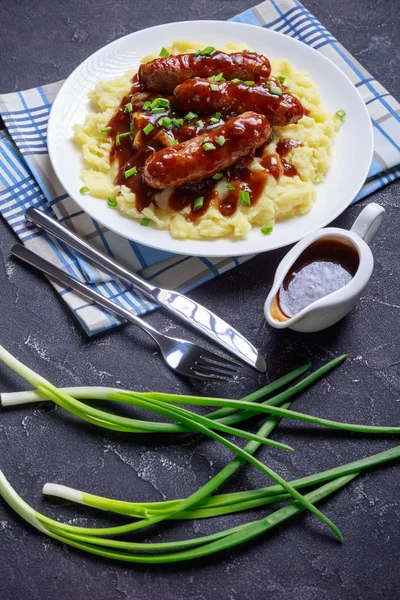 Bangers and Mash with Onion Gravy on a plate — ストック写真