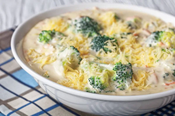 Cheesy broccoli soup in a white bowl — Stock Image Cheesy broccoli soup in a white bowl Stock Image