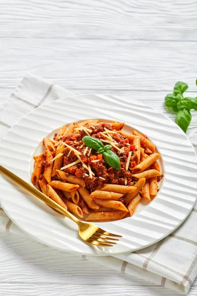 Close Pasta Bolognese Wholewheat Penne Rigate Topped Shredded Formagio Basil — Stock Photo, Image