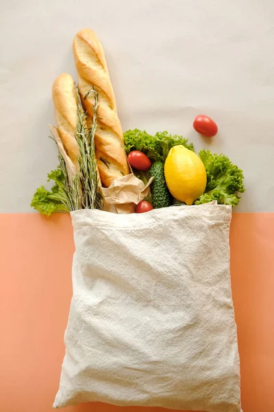 Organic vegetables long loaf in eco bag tote in market.  Products in fabric linen bag in organic food store.  Healthy nutrition, Zero Waste, Concept. Banner for for web, design. Mock up