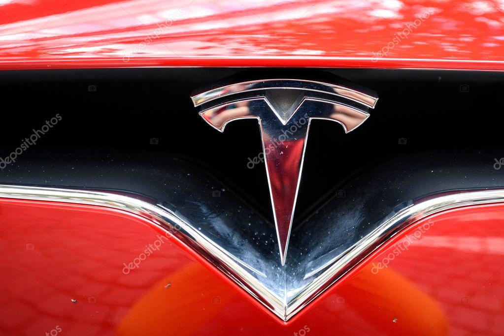 FRANKFURT, GERMANY - OCTOBER 08, 2016: Tesla logo in Frankfurt center. Tesla is an American public company designs, manufactures, and sells electric car