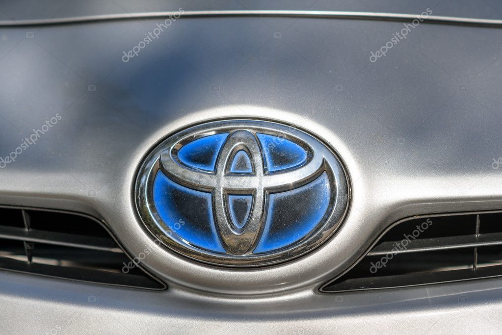 KAUNAS - OCTOBER 16, 2016: Toyota hybrid logo on Prius 2010 car. The Toyota Prius is a full hybrid electric mid-size hatchback, formerly a compact sedan, developed and manufactured by Toyota.