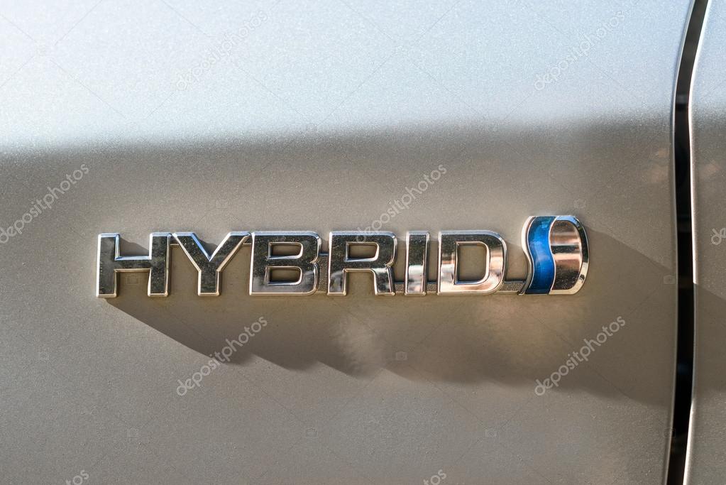KAUNAS - OCTOBER 16, 2016: Toyota hybrid logo on Prius 2010 car. The Toyota Prius is a full hybrid electric mid-size hatchback, formerly a compact sedan, developed and manufactured by Toyota.
