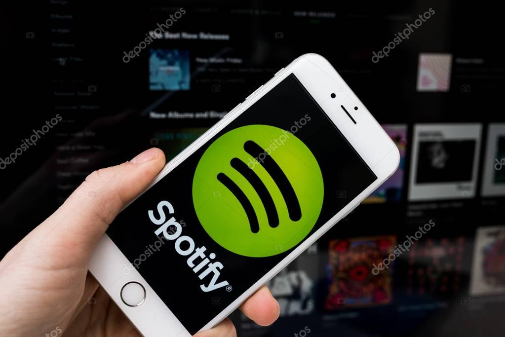 KAUNAS, LITHUANIA - APRIL 20, 2017: Apple iPhone 6S smartphone with Spotify  logo on screen. Spotify is a music service that offers legal streaming music