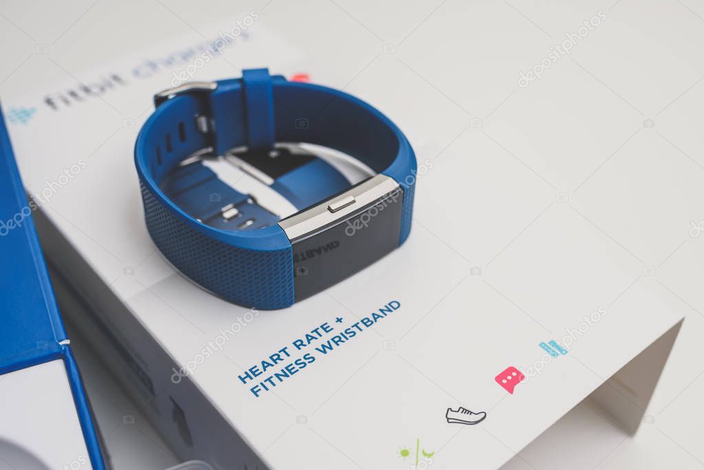 KAUNAS, LITHUANIA - JANUARY 25, 2018: Unboxing Fitbit Charge 2. This ia heart rate and fitness wristband that tracks activity.