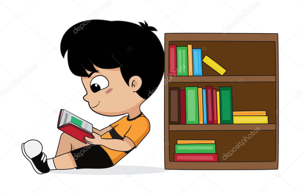 boy reading a book in the library.