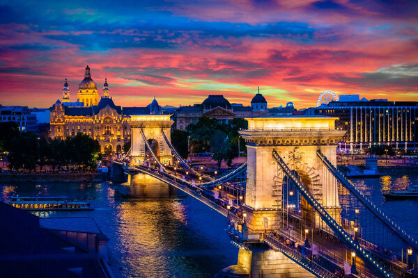 aerial shot of evening illuminated chain bridge in budapest