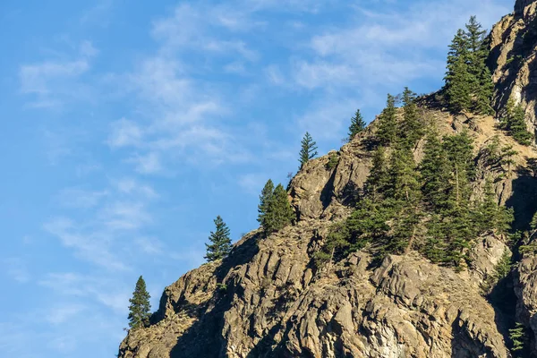 mountain in north British Columbia Canada and blue sky with clouds.