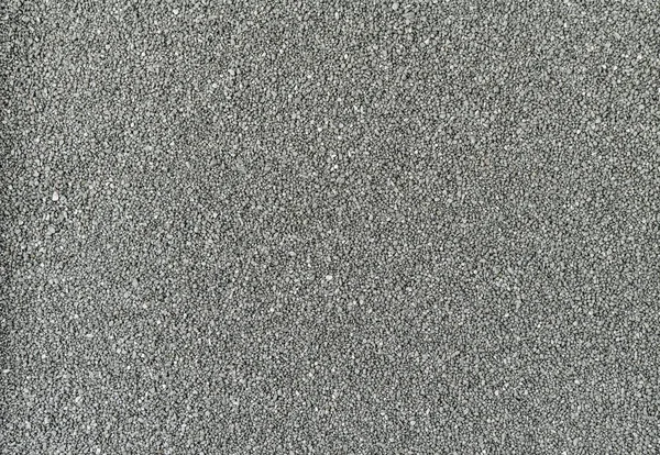Arena gris lisa textura uniforme o fondo . — Foto de Stock