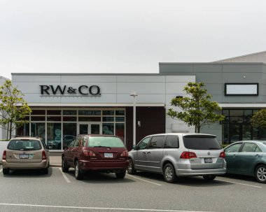 ABBOTSFORD, CANADA - JUNE 9, 2019: Shopping mall in city center with shops banks and parking lots.