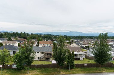ABBOTSFORD, CANADA - JUNE 9, 2019: residential area with mountains on the background.